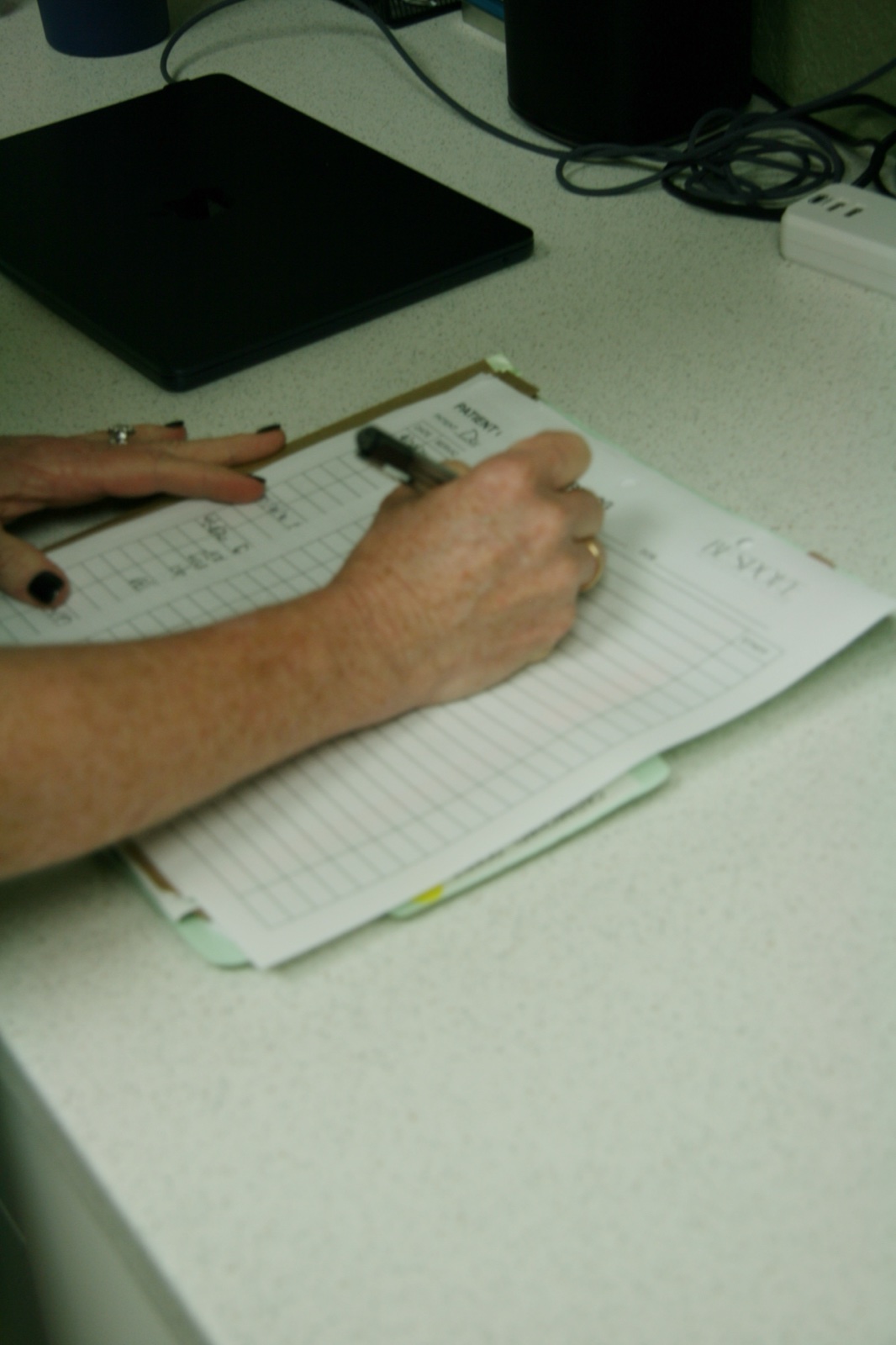 Provider hands documenting a regenerative-medicine protocol