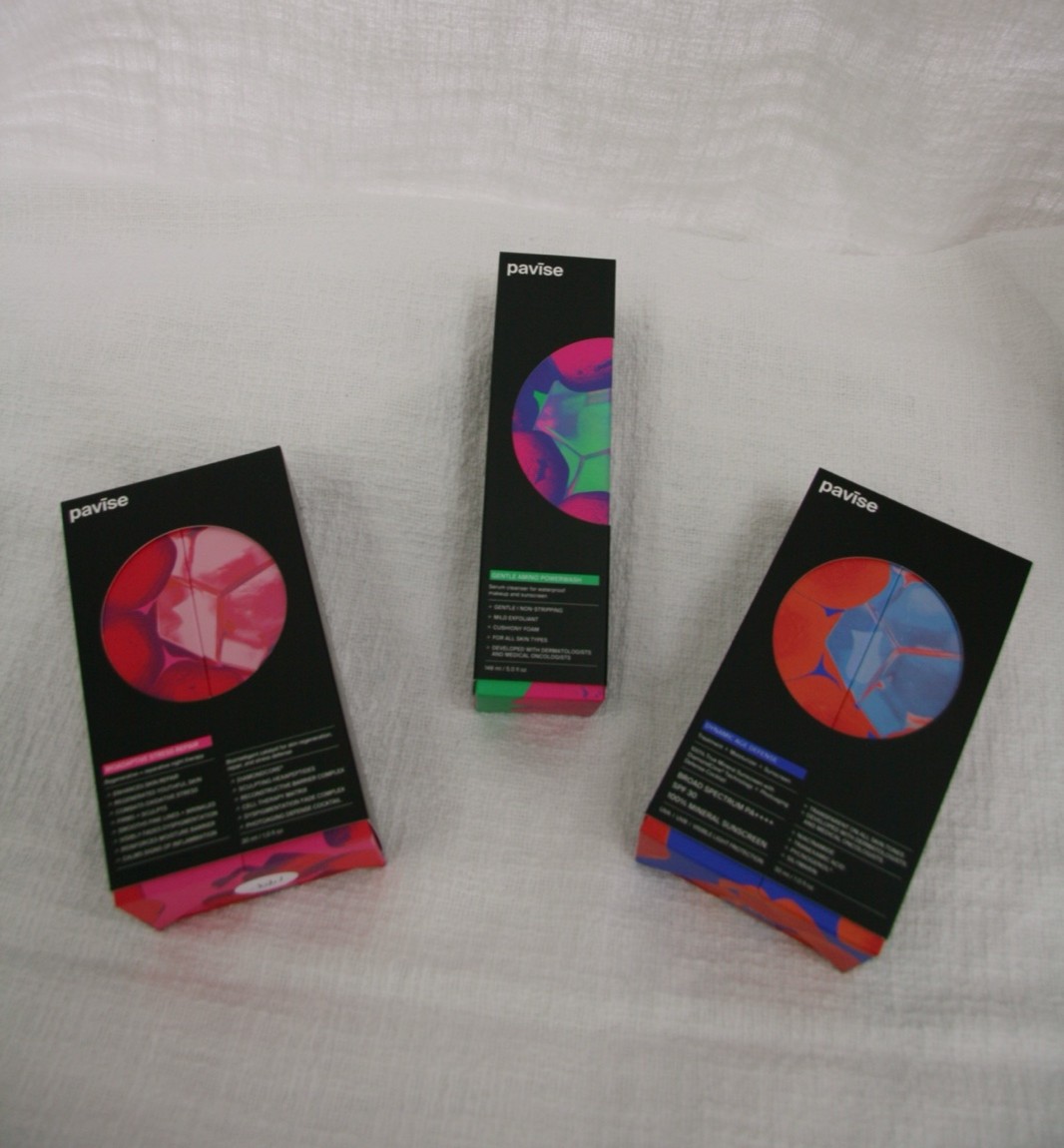 Three Pavise medical-grade sun-care boxes arranged at Bespoke Medical Aesthetics — DiamondCore broad-spectrum SPF, Dynamic Age Defense, and Photopreventive Esthetic Repair