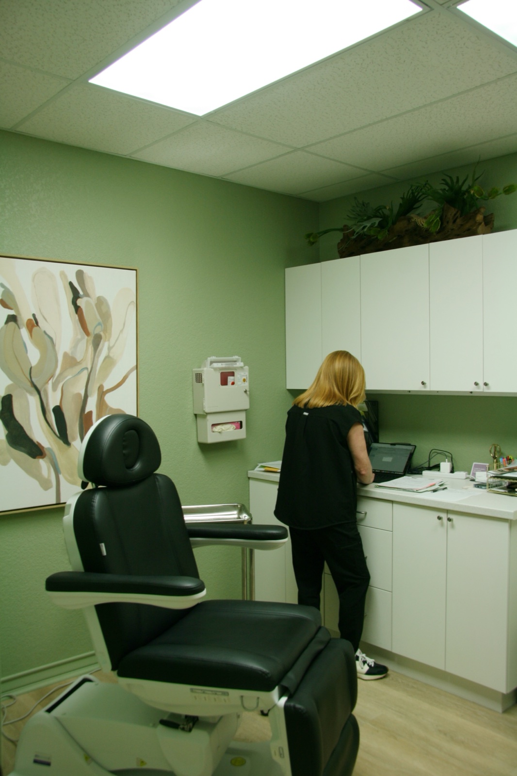 A Bespoke treatment room with sage walls — where regenerative procedures happen
